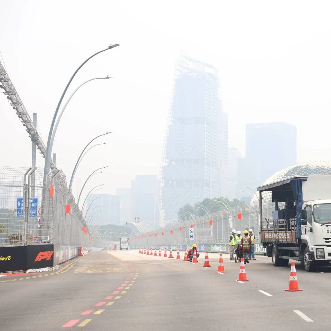 Hazy conditions seen on Esplanade Drive, Turn 13 of the Marina Bay Street Circuit, as road closures for the Formula One Singapore Grand Prix begins on Oct 7.