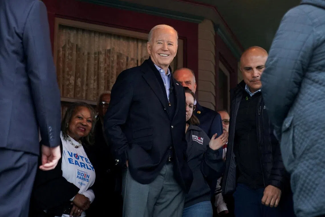 US President Joe Biden meets supporters and volunteers during a campaign event at a home in Saginaw, Michigan on March 14. 