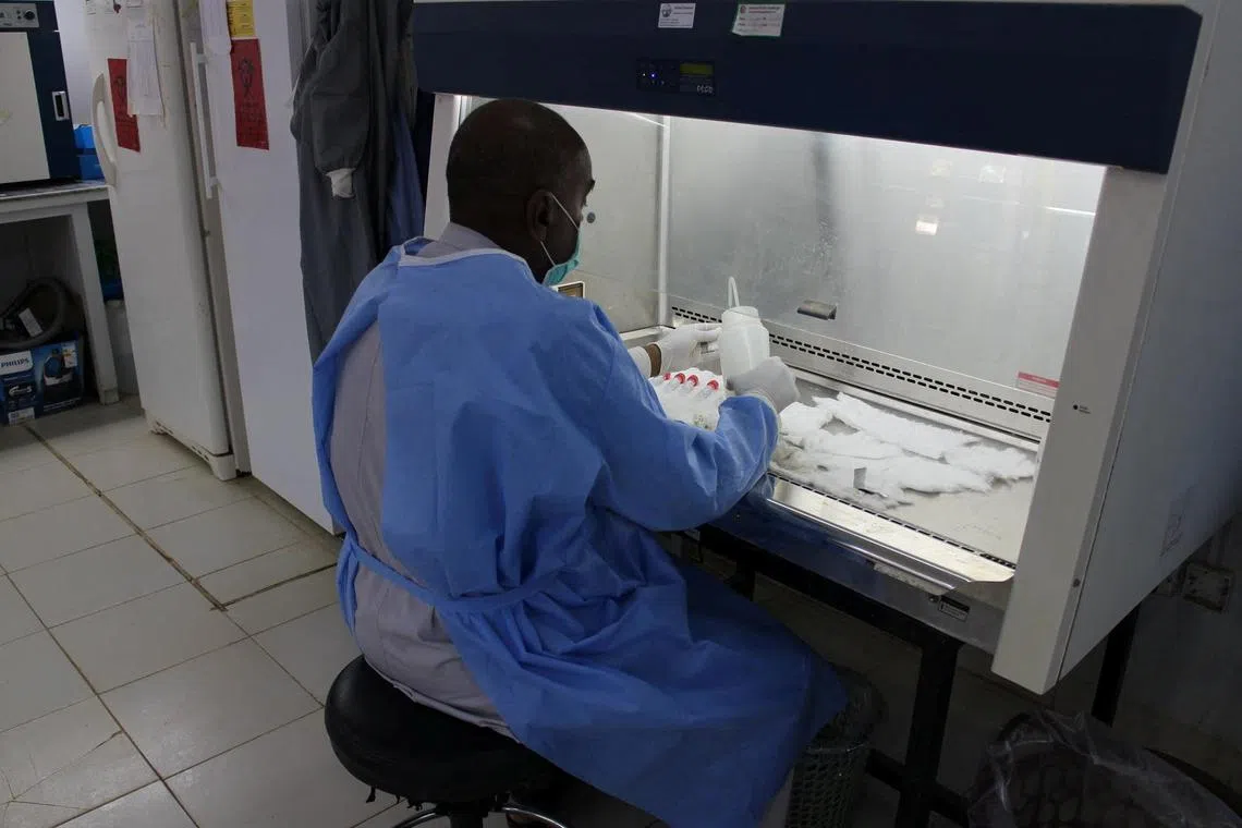 A 2020 photo shows a staff member working at the National Public Health Laboratory in Khartoum.