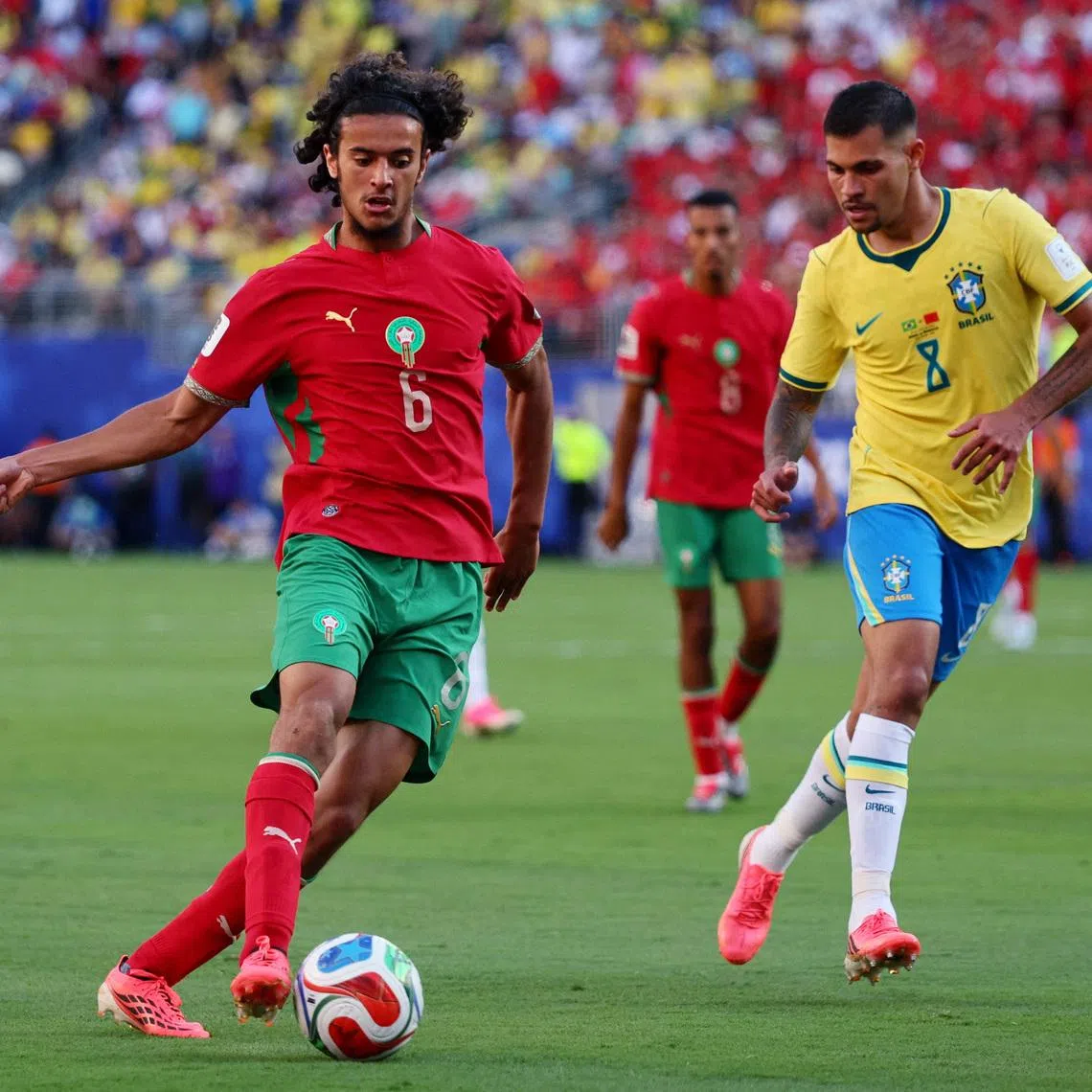 Soccer Football - FIFA World Cup 2026 - Group C - Brazil v Morocco - New York/New Jersey Stadium, East Rutherford, New Jersey, U.S. - June 13, 2026 Morocco's Ayyoub Bouaddi in action with Brazil's Bruno Guimaraes IMAGN IMAGES via Reuters/Caean Couto
