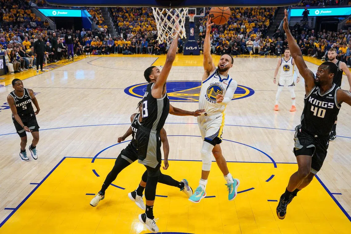Stephen Curry of the Golden State Warriors going to the basket during the first quarter against the Sacramento Kings in Game four of the Western Conference play-offs.