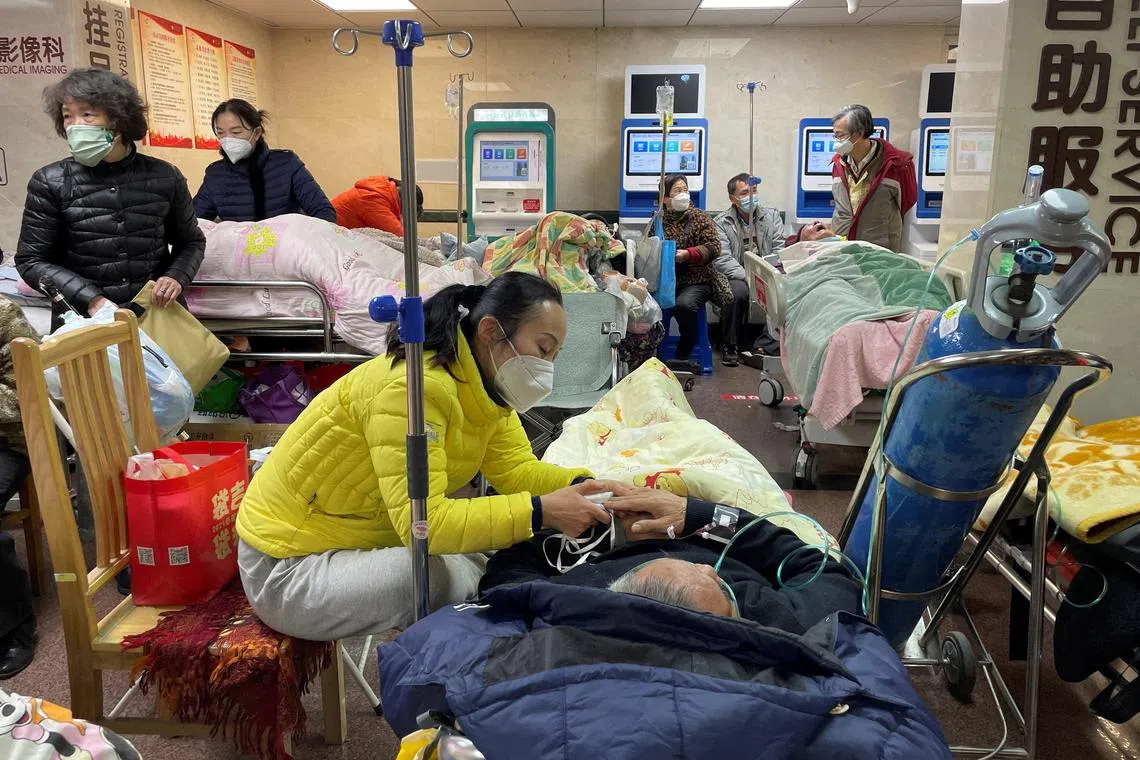 Patients at a hallway of the emergency department of a hospital in Shanghai in January amid a Covid-19 outbreak.