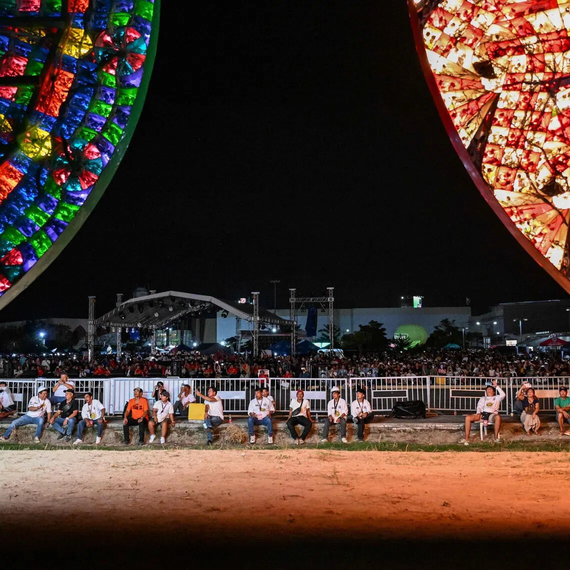 This photo taken on Dec 14 shows people watching during the Giant Lantern Festival in San Fernando, Pampanga. 