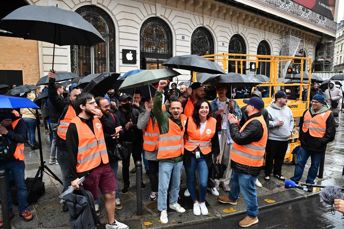 Apple store workers on strike in front of an Apple Store, near Opera in Paris.