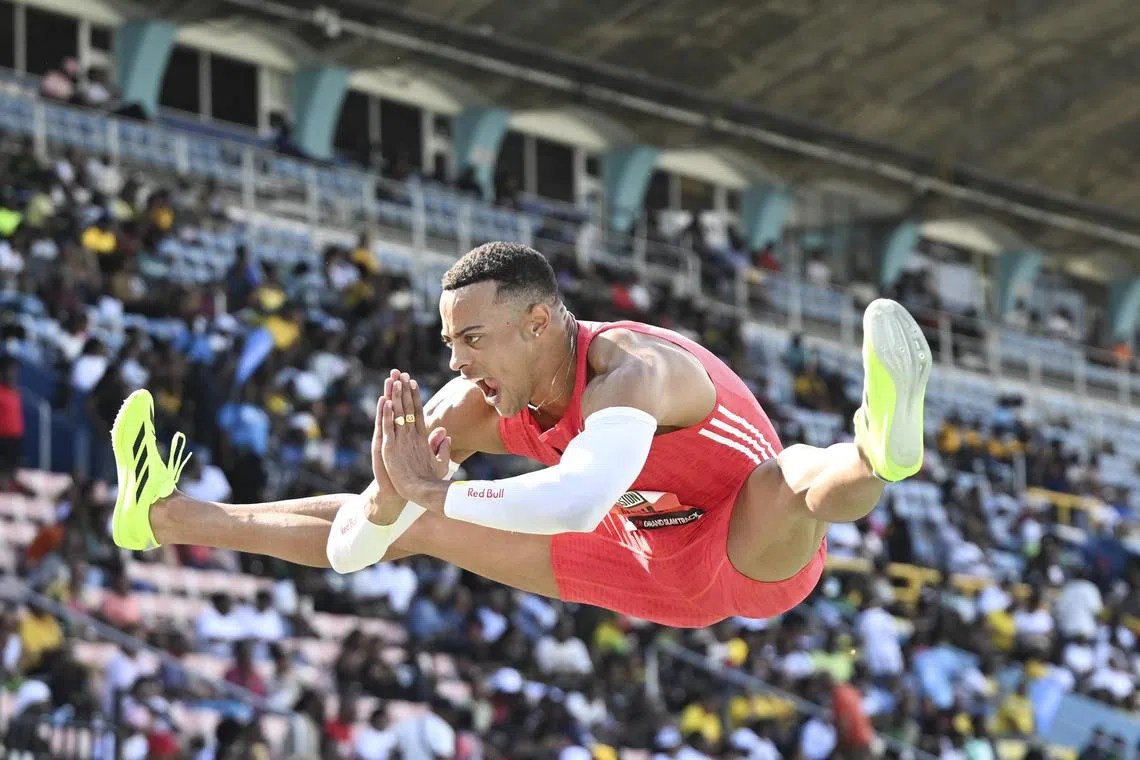 France's Sasha Zhoya celebrates winning the men's 100m race during the Grand Slam Track meet at the National Stadium, Kingston.