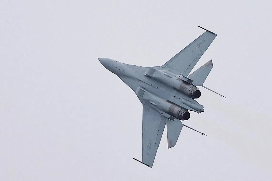 FILE PHOTO: A J-16 fighter jet performs at the China International Aviation and Aerospace Exhibition, or Airshow China, in Zhuhai, Guangdong province, China November 14, 2024. REUTERS/Tingshu Wang/File Photo