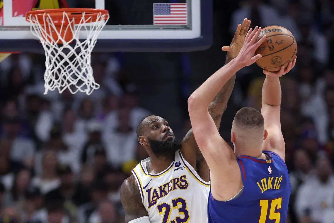 LeBron James of the Los Angeles Lakers guarding Nikola Jokic of the Denver Nuggets in the first quarter during Game 1 of the Western Conference first-round play-offs at Ball Arena on April 21. The Nuggets won 114-103.