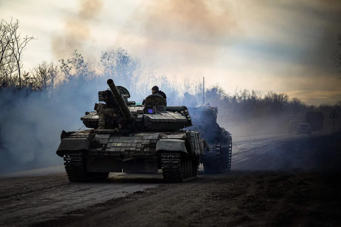 A Ukrainian tank rolls on a road near Bakhmut, in the eastern Donetsk region, on November 30, 2022.