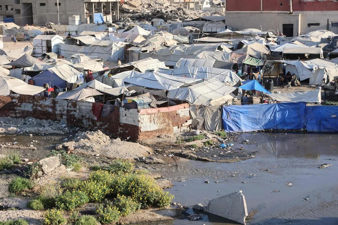 Footage from Gaza City shows stagnant pools of murky water full of garbage surrounding makeshift shelters.
