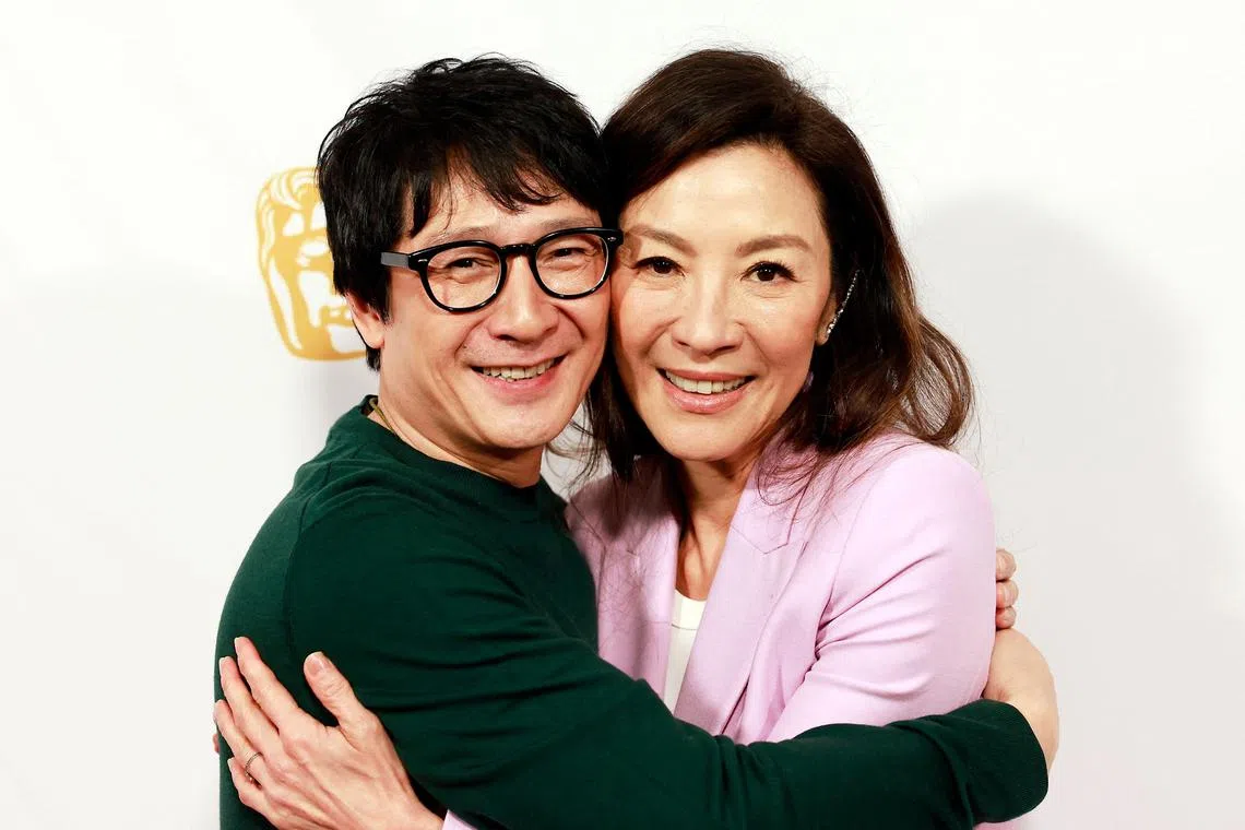 US-Vietnamese actor Ke Huy Quan (L) and Malaysian actress Michelle Yeoh arrive for the BAFTA Tea Party at the Four Seasons Hotel in Los Angeles, California, on January 14, 2023. (Photo by Michael Tran / AFP)