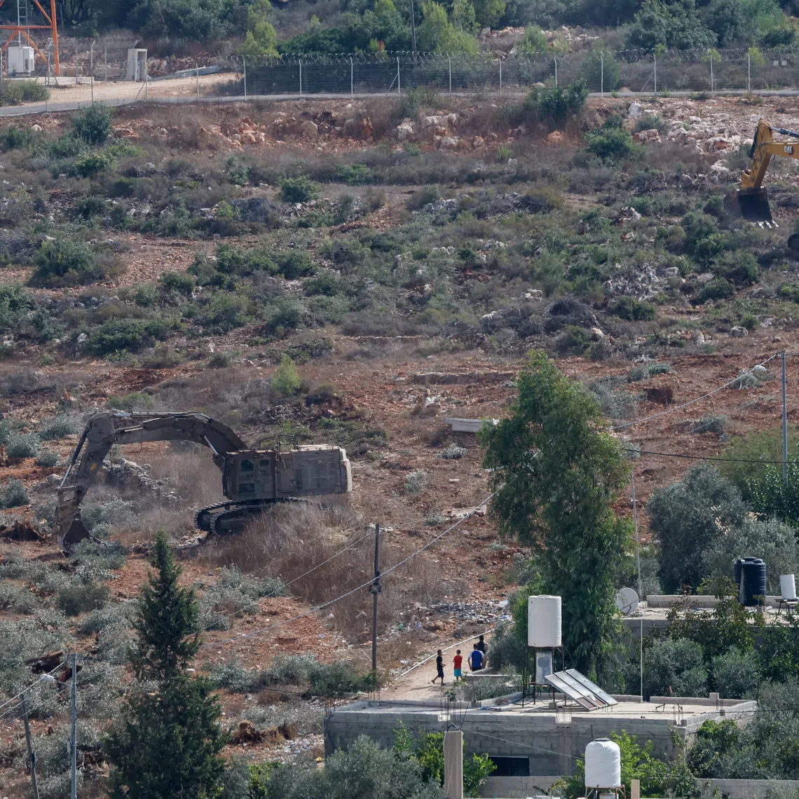 Israeli machinery uproot olive trees near the Palestinian village of Deir Nizam near Ramallah, in the Israeli-occupied West Bank, September 23, 2026. REUTERS/Mohammed Torokman