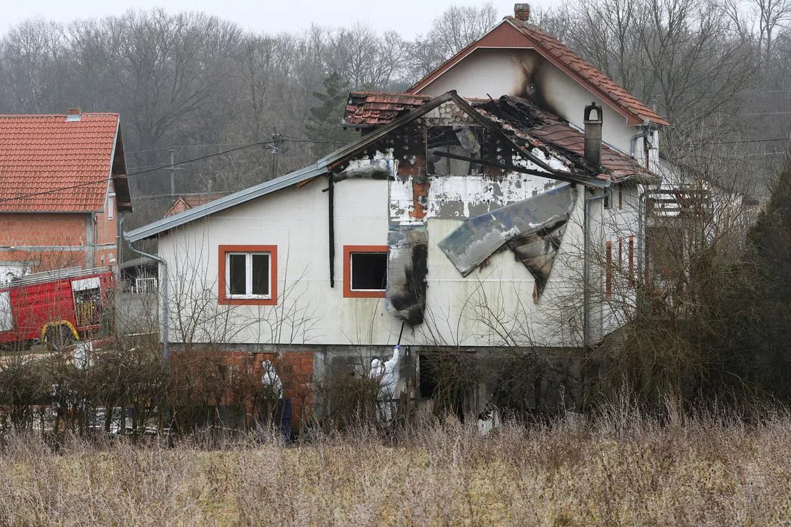 FILE PHOTO: Emergency personnel work at a damaged nursing home that caught fire, outside Belgrade, Serbia, January 20, 2025. REUTERS/Djordje Kojadinovic/File Photo