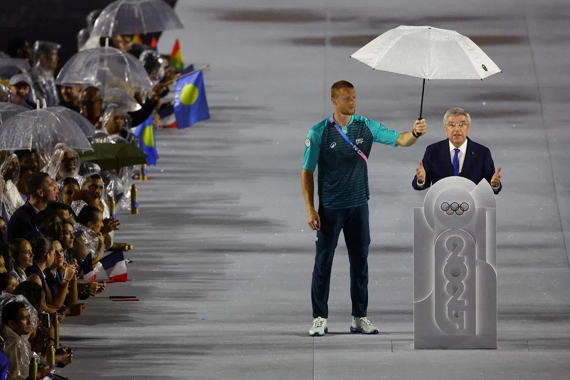 Paris 2024 Olympics - Opening Ceremony - Paris, France - July 26, 2024. President of the International Olympic Committee (IOC) Thomas Bach speaks during the opening ceremony REUTERS/Hannah Mckay TPX IMAGES OF THE DAY
