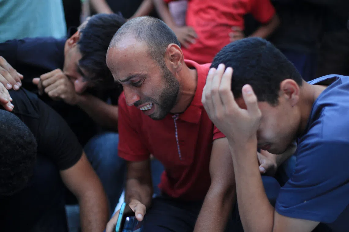 Mourners react after Palestinians were killed in an Israeli strike on a cafe, at Al-Shifa hospital in Gaza City August 18, 2026. REUTERS/Dawoud Abu Alkas