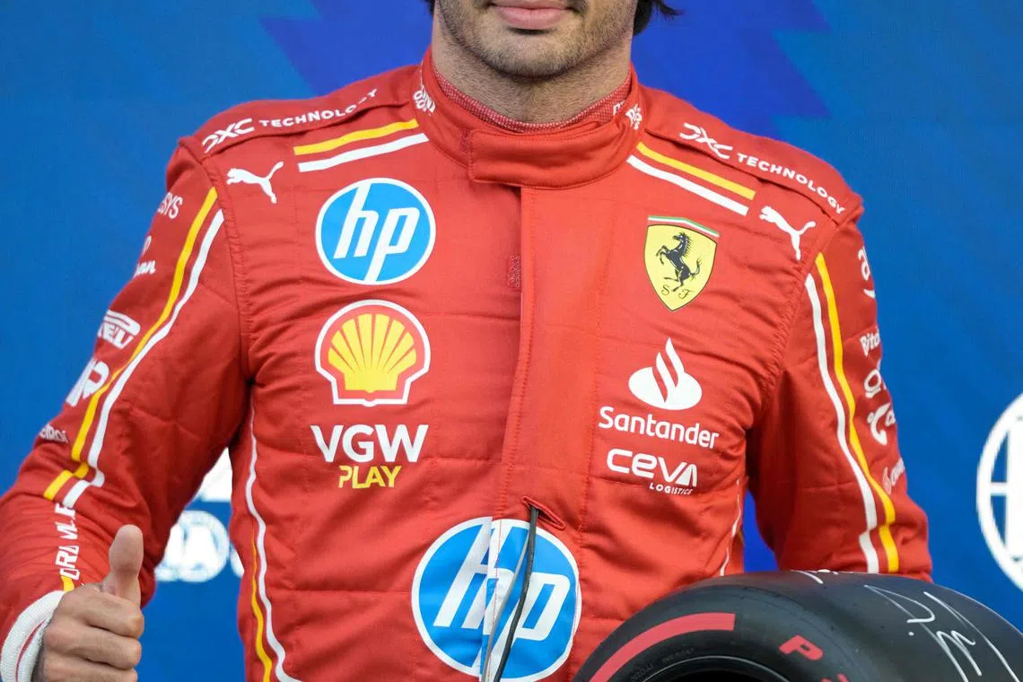 Ferrari's pole-sitting Spanish driver Carlos Sainz posing for a picture after the qualifying session of the Formula One Mexico City Grand Prix at the Hermanos Rodriguez racetrack in Mexico City on Oct 26.