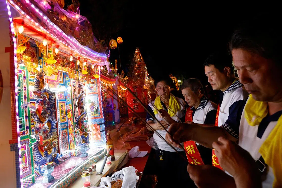 Pilgrims taking part in the Hungry Ghost Festival, in Keelung, Taiwan on August 29, 2023. REUTERS/Ann Wang