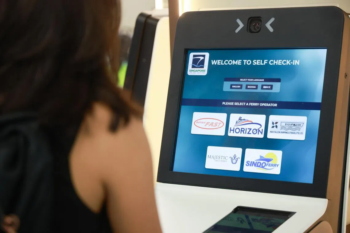 A self-service kiosk at the Singapore Cruise Centre (HarbourFront) terminal.