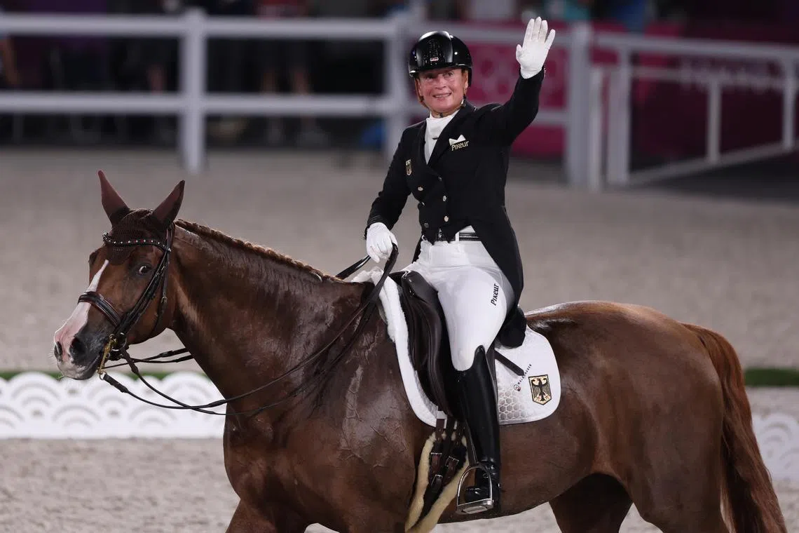 FILE PHOTO: Tokyo 2020 Olympics - Equestrian - Dressage - Individual - Grand Prix Freestyle - Equestrian Park - Tokyo, Japan - July 28, 2021. Isabell Werth of Germany on her horse Bella Rose II reacts REUTERS/Alkis Konstantinidis/File Photo