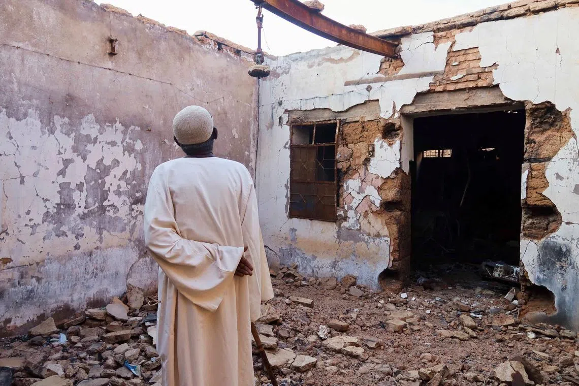 Hajj Ahmed, a resident of the Old-Omdurman neighbourhood, looks at his house after it was damaged by shells in Omdurman, Sudan, November 8, 2024. REUTERS/El Tayeb Siddig/File Photo