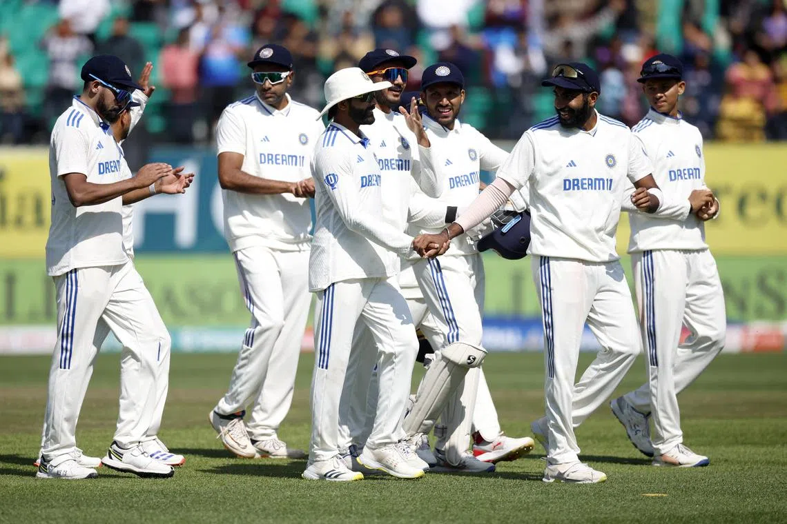 Cricket - Fifth Test - India v England - Himachal Pradesh Cricket Association Stadium, Dharamshala, India - March 9, 2024 India's Rohit Sharma and teammates celebrate after the match REUTERS/Adnan Abidi