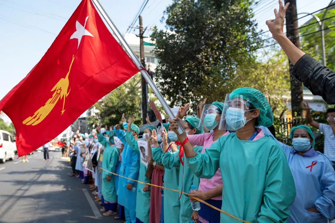 FILE PHOTO: Medical workers rally against the military coup and to demand the release of elected leader Aung San Suu Kyi, in Yangon, Myanmar, February 10, 2021. REUTERS/Stringer/File Photo