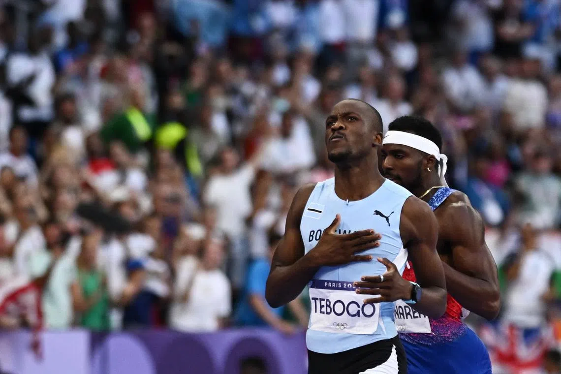 Paris 2024 Olympics - Athletics - Men's 200m Final - Stade de France, Saint-Denis, France - August 08, 2024. Letsile Tebogo of Botswana celebrates winning gold. REUTERS/Dylan Martinez