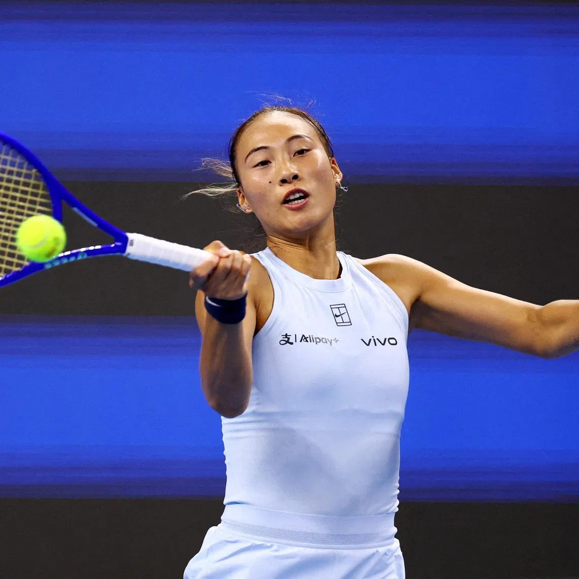 FILE PHOTO: Tennis - China Open - The Beijing Olympic Green Tennis Center, Beijing, China - September 29, 2025 China's Qinwen Zheng in action during her round of 32 match against Czech Republic's Linda Noskova. REUTERS/Tingshu Wang/File Photo