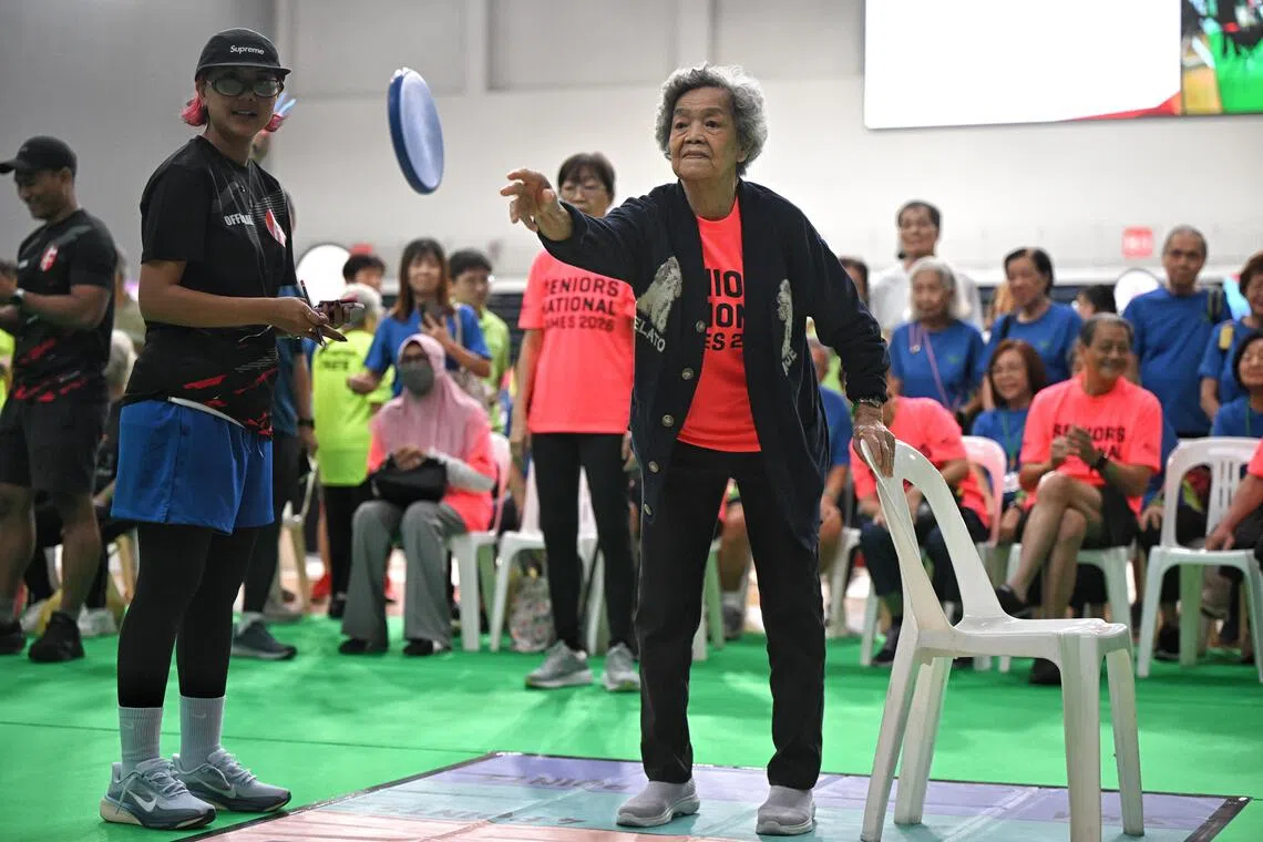 Madam Kwok Noi, 90, takes part in the disc golf finals during the Seniors National Games Finals held at the OCBC Arena on August 4, 2026.