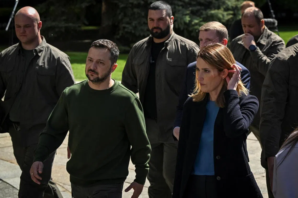 Ukrainian President Volodymyr Zelensky and European Parliament President Roberta Metsola leaving a joint press conference in Kyiv during an air raid alert, on May 9, 2024. 