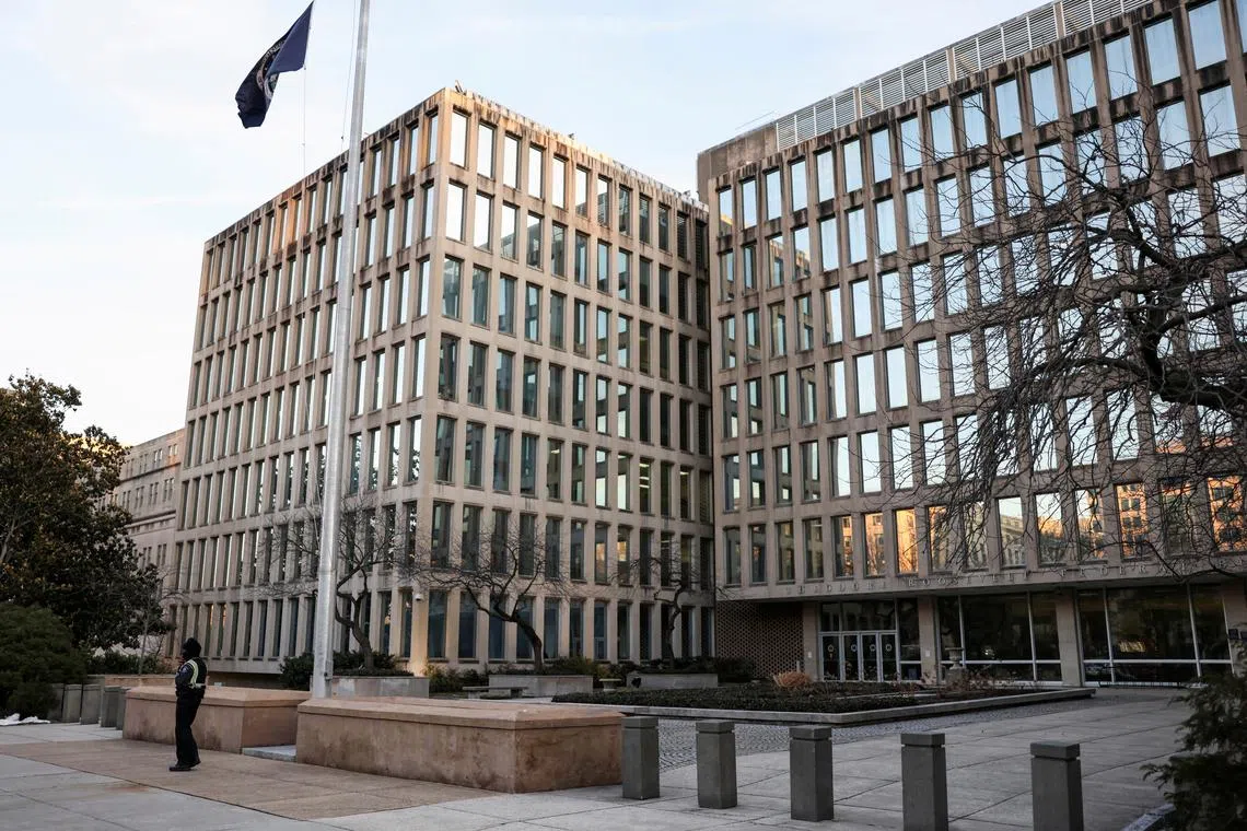 FILE PHOTO: A security member stands outside the headquarters of the Office of Personnel Management (OPM), after probationary staff at the OPM were fired in a conference call and given less than an hour to leave the building, in Washington, D.C., U.S., February 13, 2025. REUTERS/Tierney L. Cross/File Photo