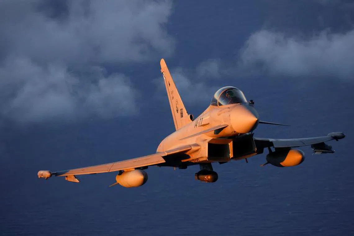 FILE PHOTO: A Eurofighter EF-2000 fighter aircraft of the Spanish Air Force flies during the Ocean Sky 2023 Military Exercise for advanced air-to-air training in the southern airspace of the Canary Islands, Spain, October 25, 2023. REUTERS/Borja Suarez/File Photo
