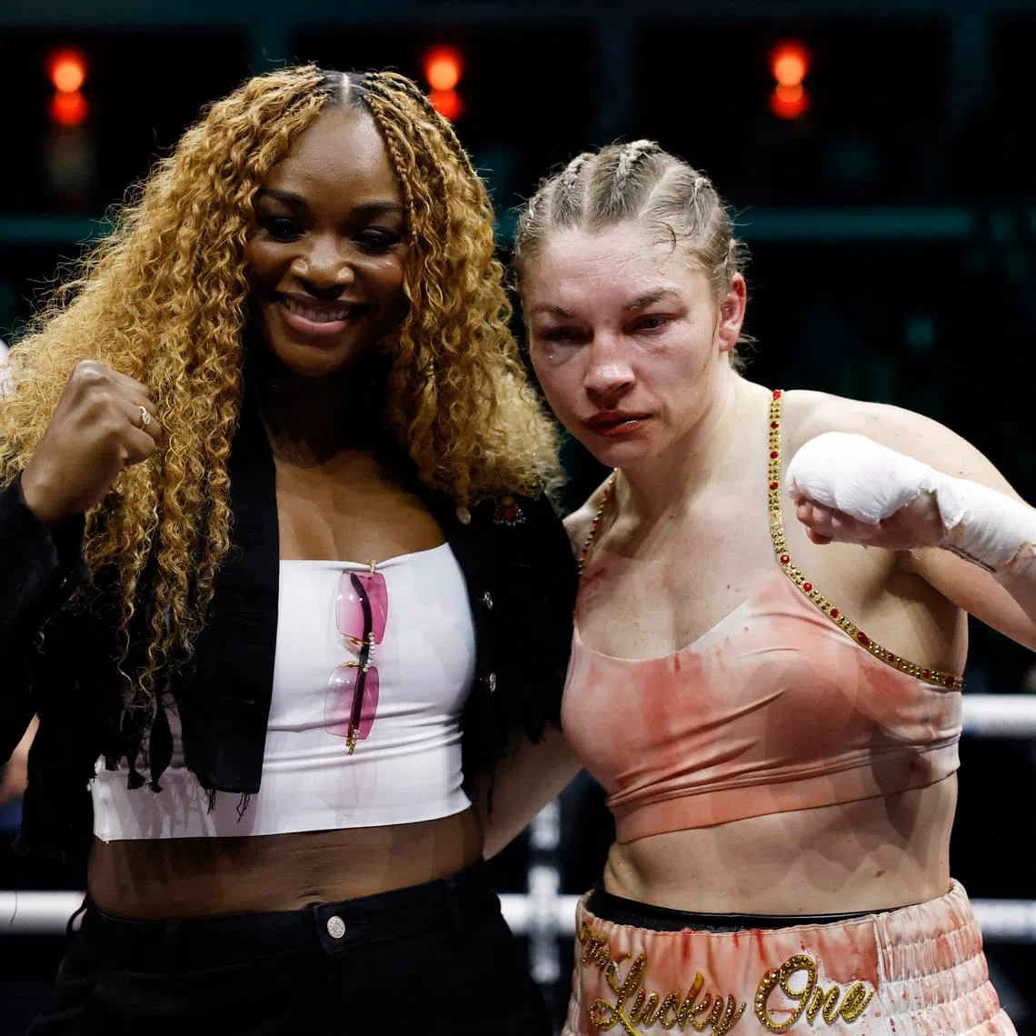 Boxing - Lauren Price v Stephanie Pineiro Aquino - WBA, WBC, IBF & IBO World Welterweight Titles - Cardiff International Arena, Cardiff, Wales - April 4, 2026 Lauren Price poses with Claressa Shields after winning her fight against Stephanie Pineiro Aquino Action Images via Reuters/Andrew Couldridge