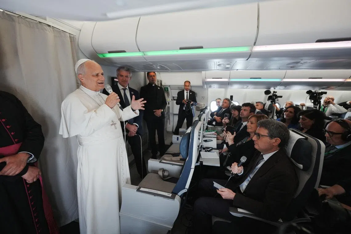 Pope Leo XIV speaks to journalists aboard the papal flight from Malabo to Rome, April 23, 2026, at the end of his 11-day pastoral visit to Africa.     Andrew Medichini/Pool via REUTERS