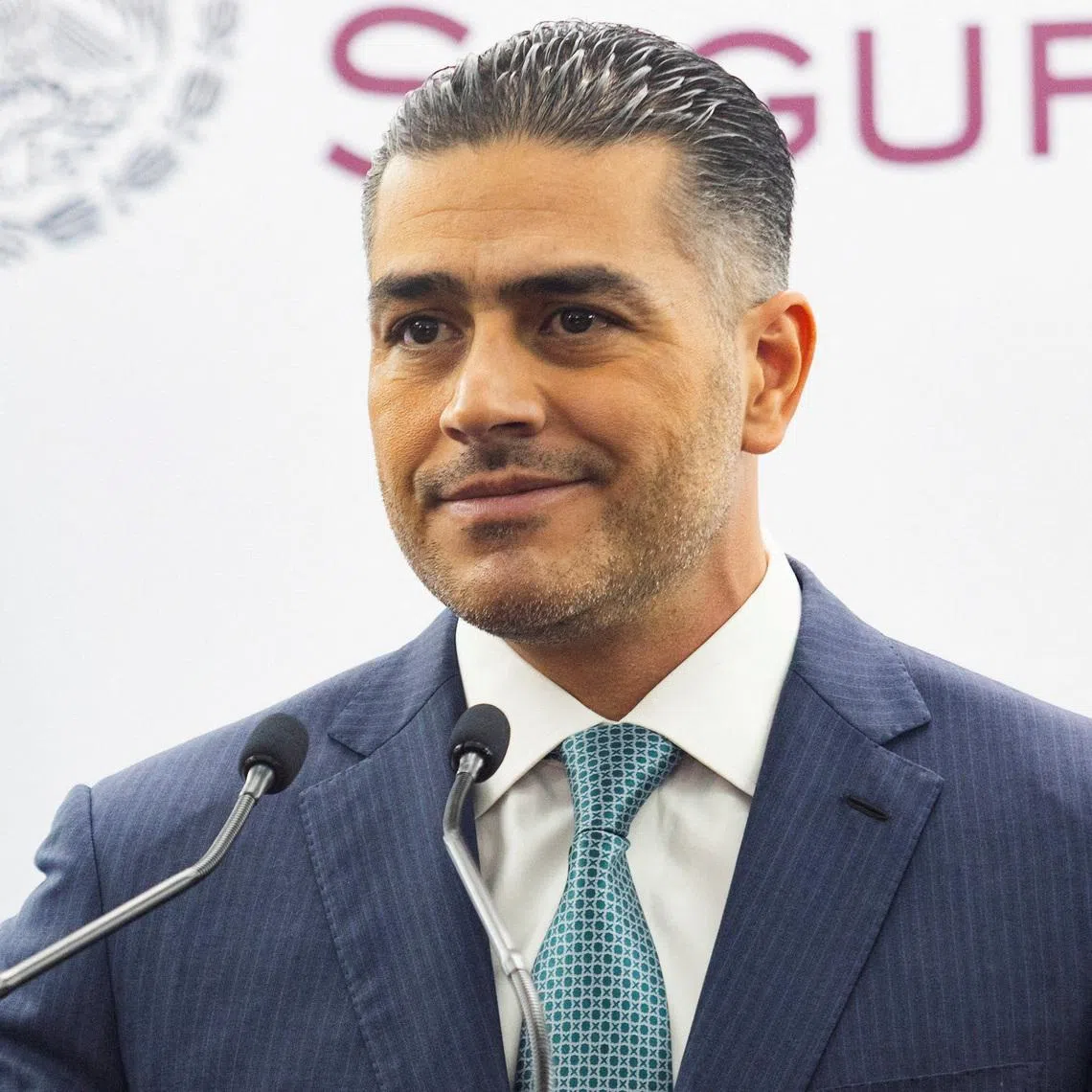 FILE PHOTO: Mexico's Secretary of Security and Citizen Protection Omar Garcia Harfuch looks on during a press conference confirming the detention of two suspects linked to the killing of former Uruapan mayor Carlos Manzo in November 2025, in Mexico City, Mexico, January 11, 2026. REUTERS/Quetzalli Nicte-Ha/File Photo