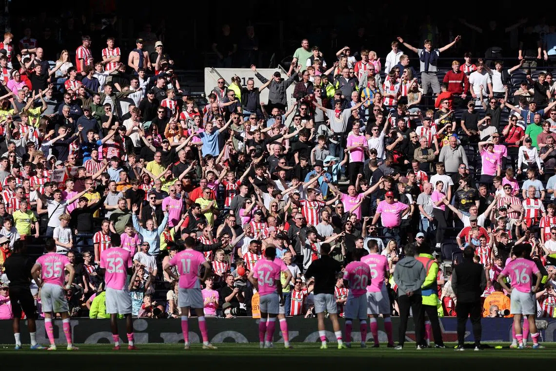 Southampton fans with their players after the 3-1 Premier League loss to Tottenham which confirmed their relegation.