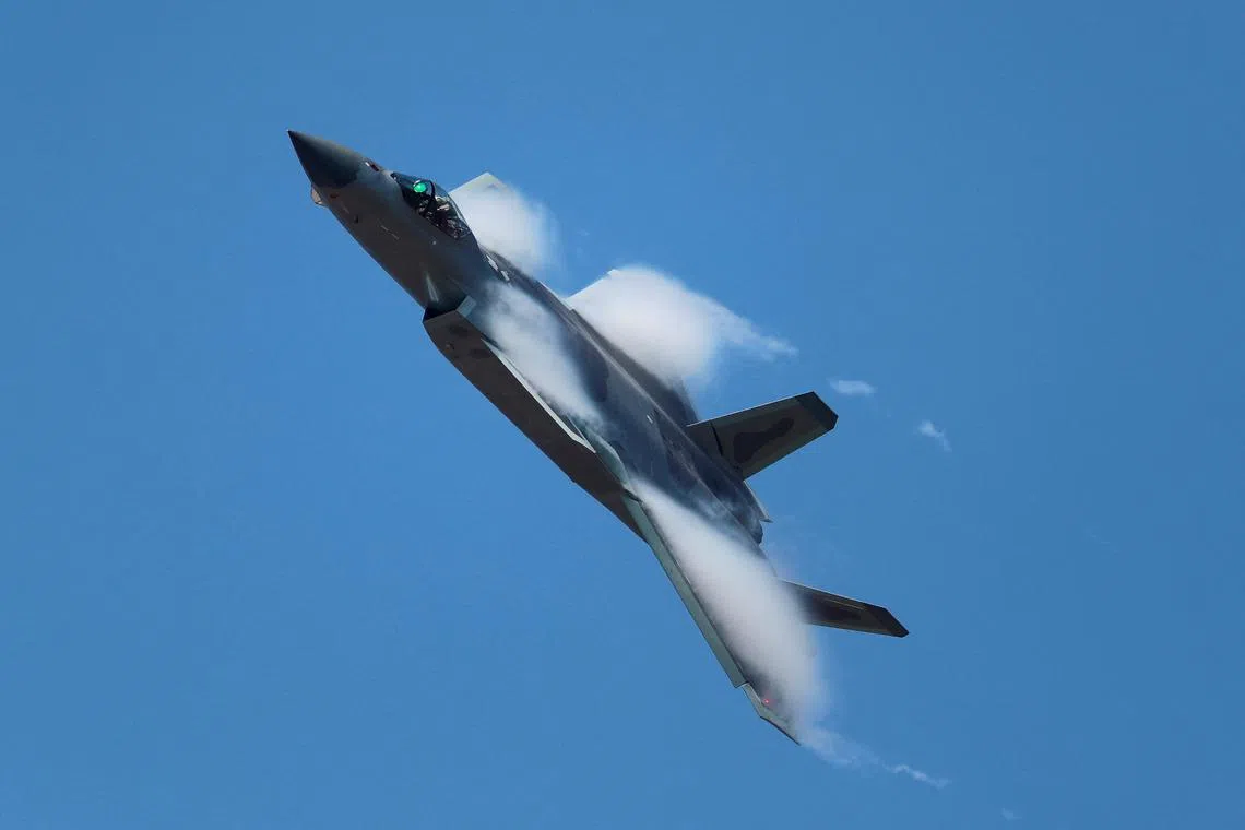 A J-20 stealth fighter jet of the Chinese People's Liberation Army (PLA) Air Force performs at the China International Aviation and Aerospace Exhibition, or Airshow China, in Zhuhai, Guangdong province, China November 9, 2022. China Daily via REUTERS ATTENTION EDITORS - THIS IMAGE WAS PROVIDED BY A THIRD PARTY. CHINA OUT. 