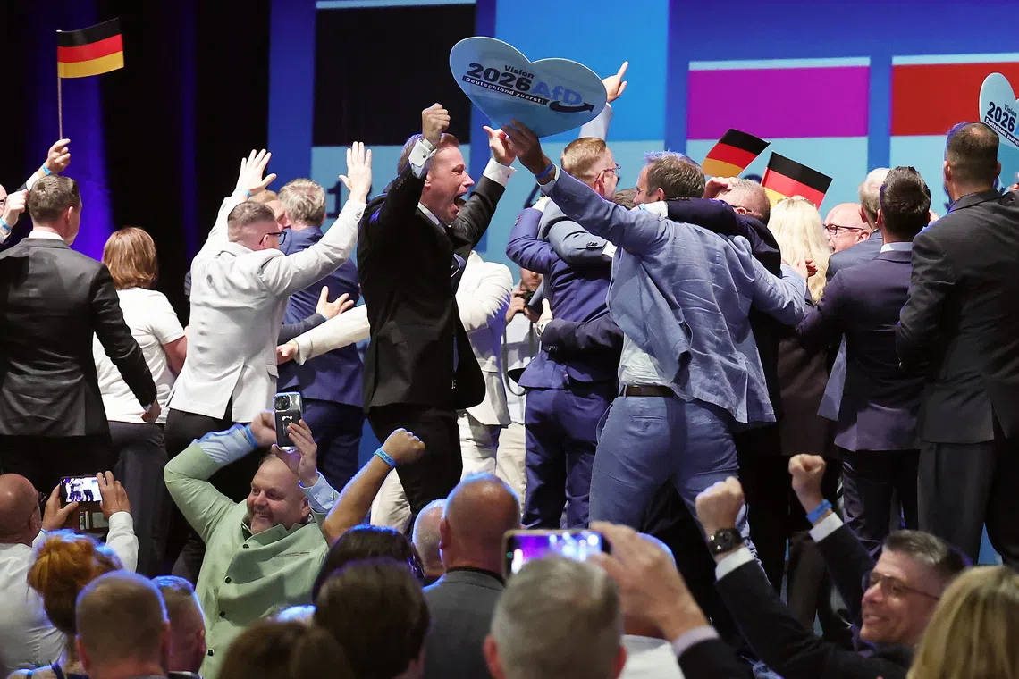 People reacting to exit polls during the far-right Alternative for Germany election party following Saxony-Anhalt state election, in Magdeburg, Germany.