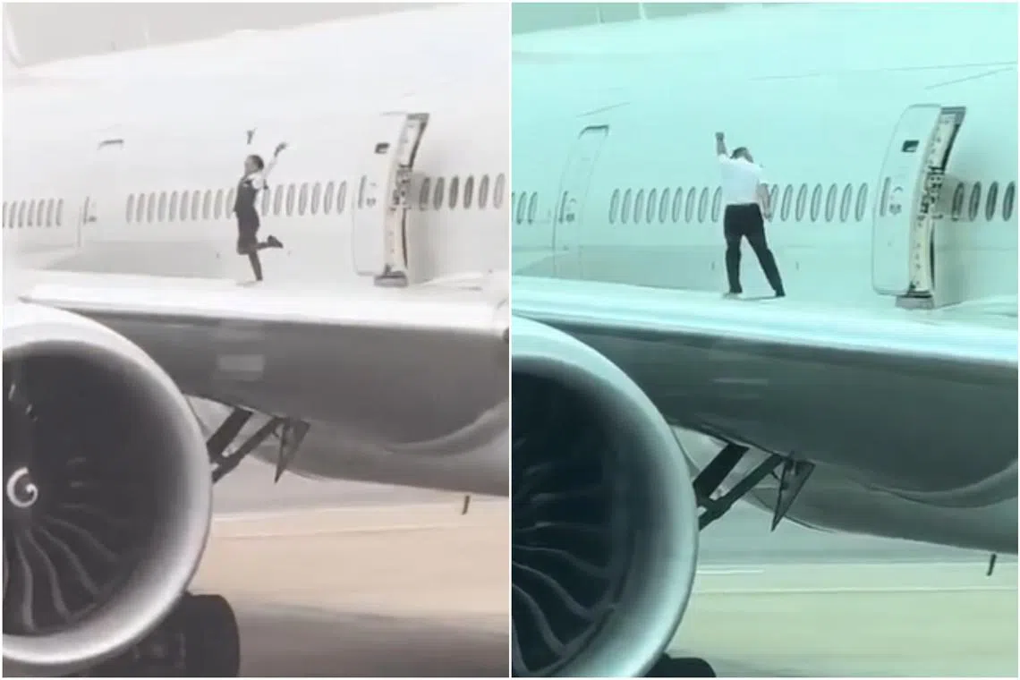 In a viral video, a flight attendant is seen dancing and posing for a photo on the wing and another crew member strikes bodybuilding poses.