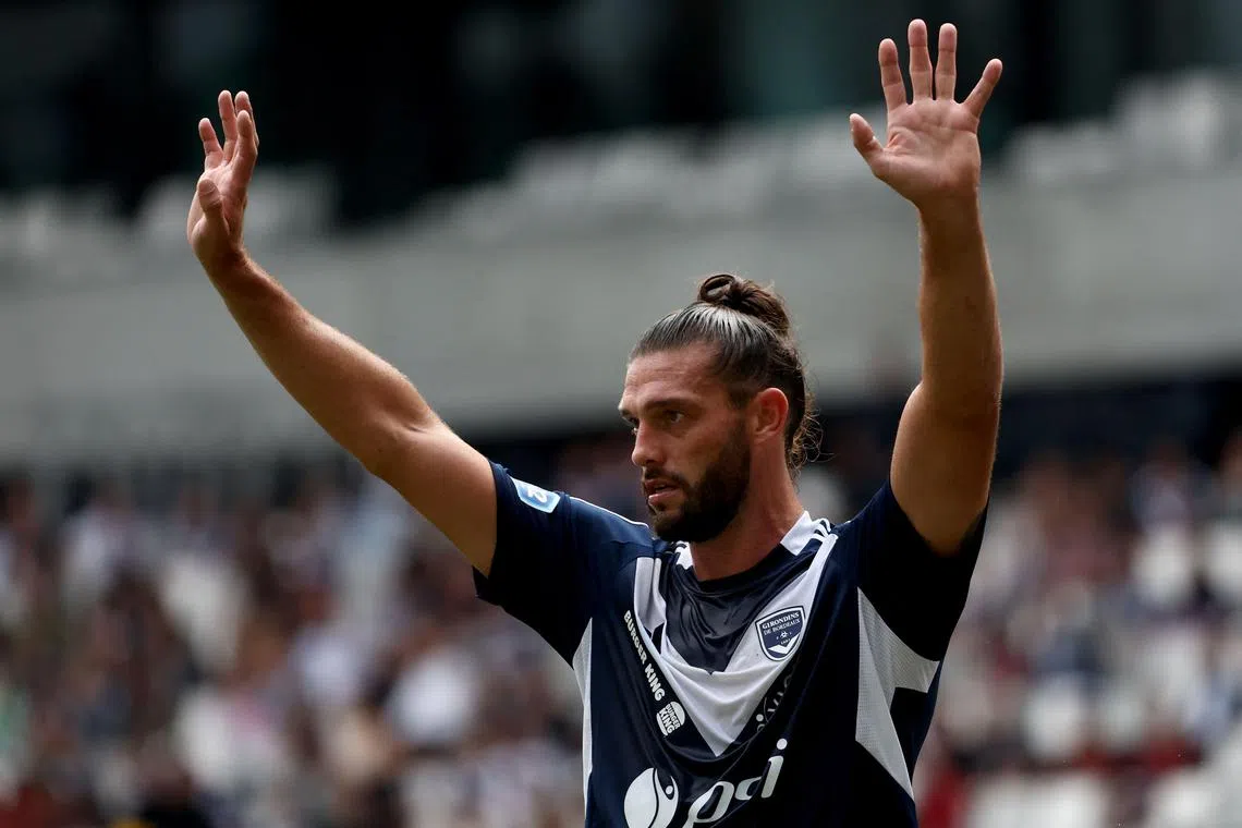 Bordeaux's English forward Andy Carroll waves during the French Nationale 2 football match between Girondins de Bordeaux and Voltigeurs de Chateaubriant at the Matmut Atlantique Stadium in Bordeaux, south-western France, on September 21, 2024. After losing their professional status and being administratively demoted to Nationale 2, an amateur level, by the Direction Nationale du Controle de Gestion (DNCG) this summer, one of the biggest winners in French football is back on September 21, 2024. (Photo by ROMAIN PERROCHEAU / AFP)