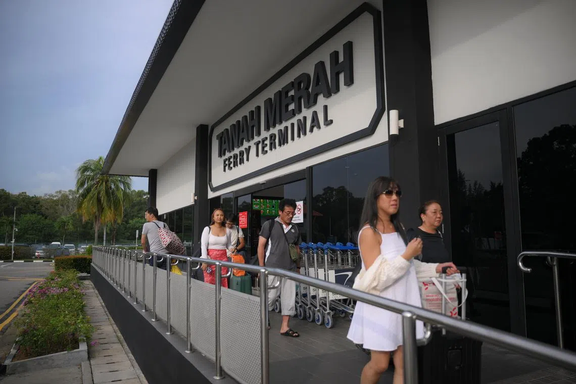 Passengers exit Tanah Merah Ferry Terminal on June 21, 2025.