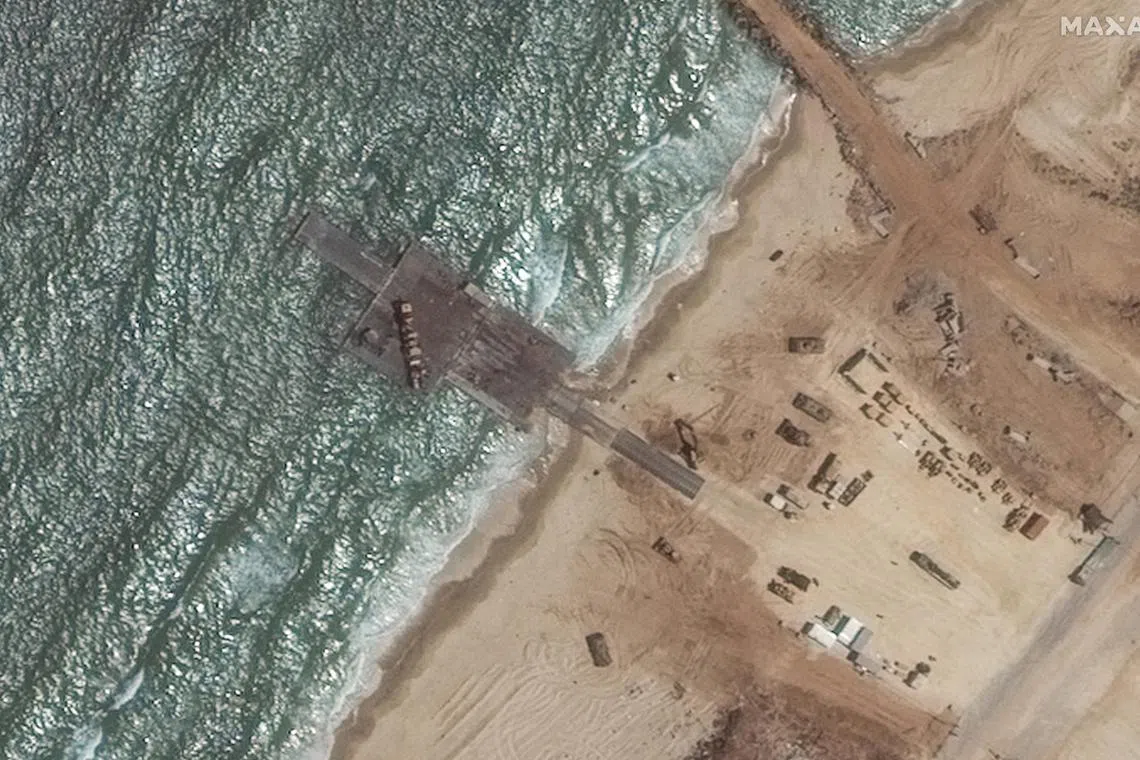 A satellite image shows a view of the remaining section of the trident pier on the Gaza shoreline on May 29. The structure had been damaged by high seas. 