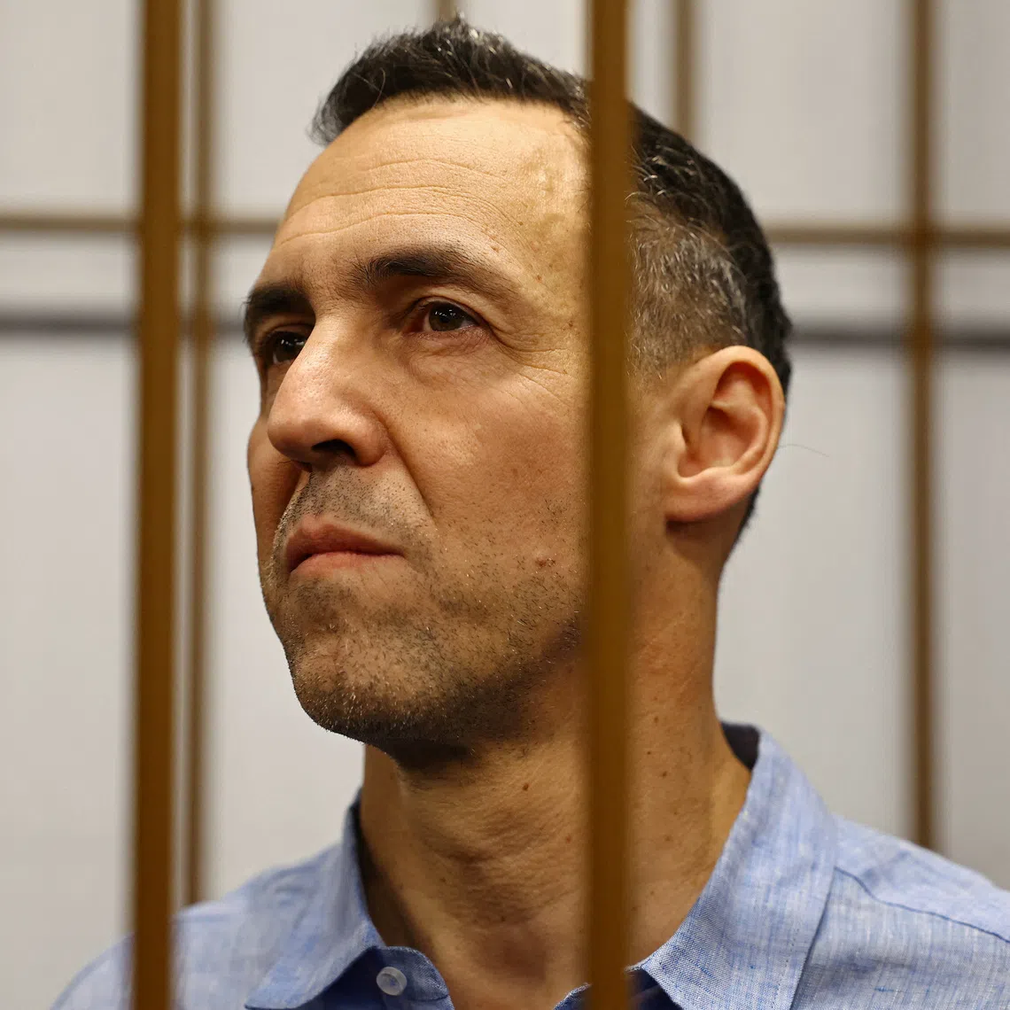 French researcher Laurent Vinatier, who is suspected of illegally collecting sensitive Russian military information, stands inside an enclosure for defendants during a court hearing in Moscow, Russia October 14, 2024. REUTERS/Evgenia Novozhenina
