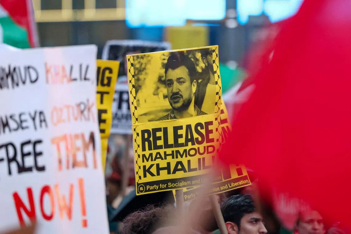 FILE PHOTO: Protesters supporting Mahmoud Khalil rally in Times Square, the day after a U.S. immigration judge ruled that Columbia student Khalil, who led pro-Palestinian student protests on campus, can be deported, in New York City, New York, U.S., April 12, 2025. REUTERS/Caitlin Ochs/File Photo