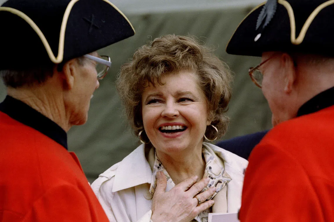 Actress Prunella Scales (centre, at a tea party event in Britain) was diagnosed with vascular dementia in 2013, but continued to work for several years.