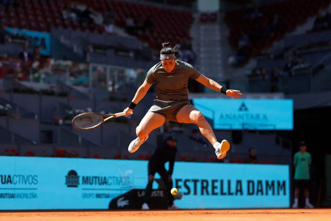 Tunisia's Ons Jabeur jumping during her 6-0, 6-4 Madrid Open last-16 win against Latvia's Jelena Ostapenko at Caja Magica in Madrid on April 29.