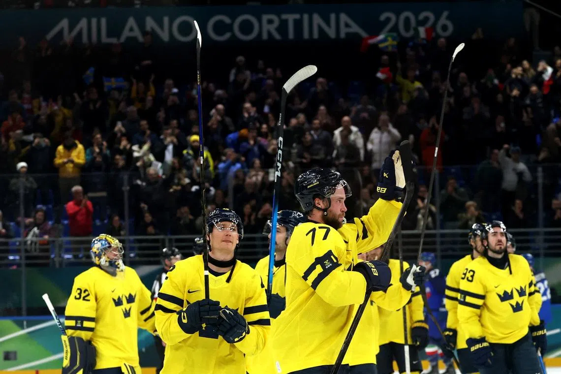 Ice hockey-Sweden overcome surprise Italy fight, Slovakia stun defending champs Finland