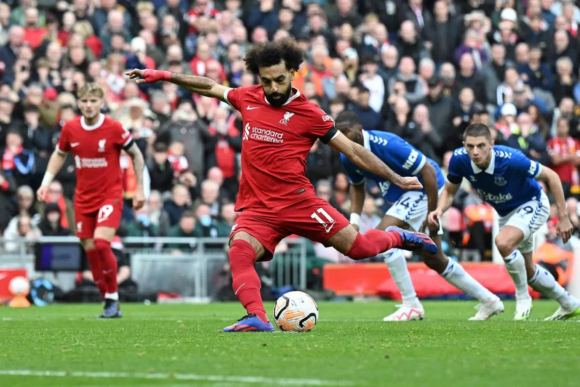 Liverpool striker Mohamed Salah scoring the first of his two goals from the penalty spot in the 2-0 Premier League win over Everton.