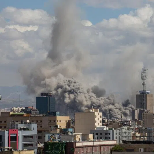 Smoke rises after coordinated US and Israeli airstrikes in Tehran, Iran, on March 1, 2026, as joint military operations hit targets in the capital.