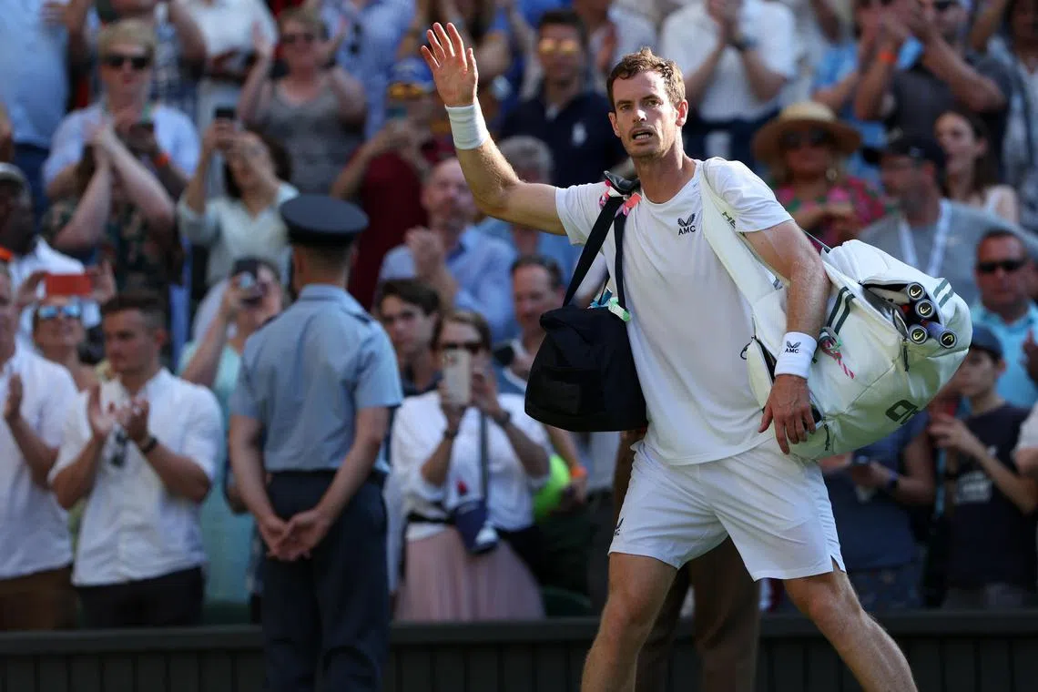 Briton Andy Murray waves as he leaves the court after losing his secon-round match against Stefanos Tsitsipas of Greece on Friday.
