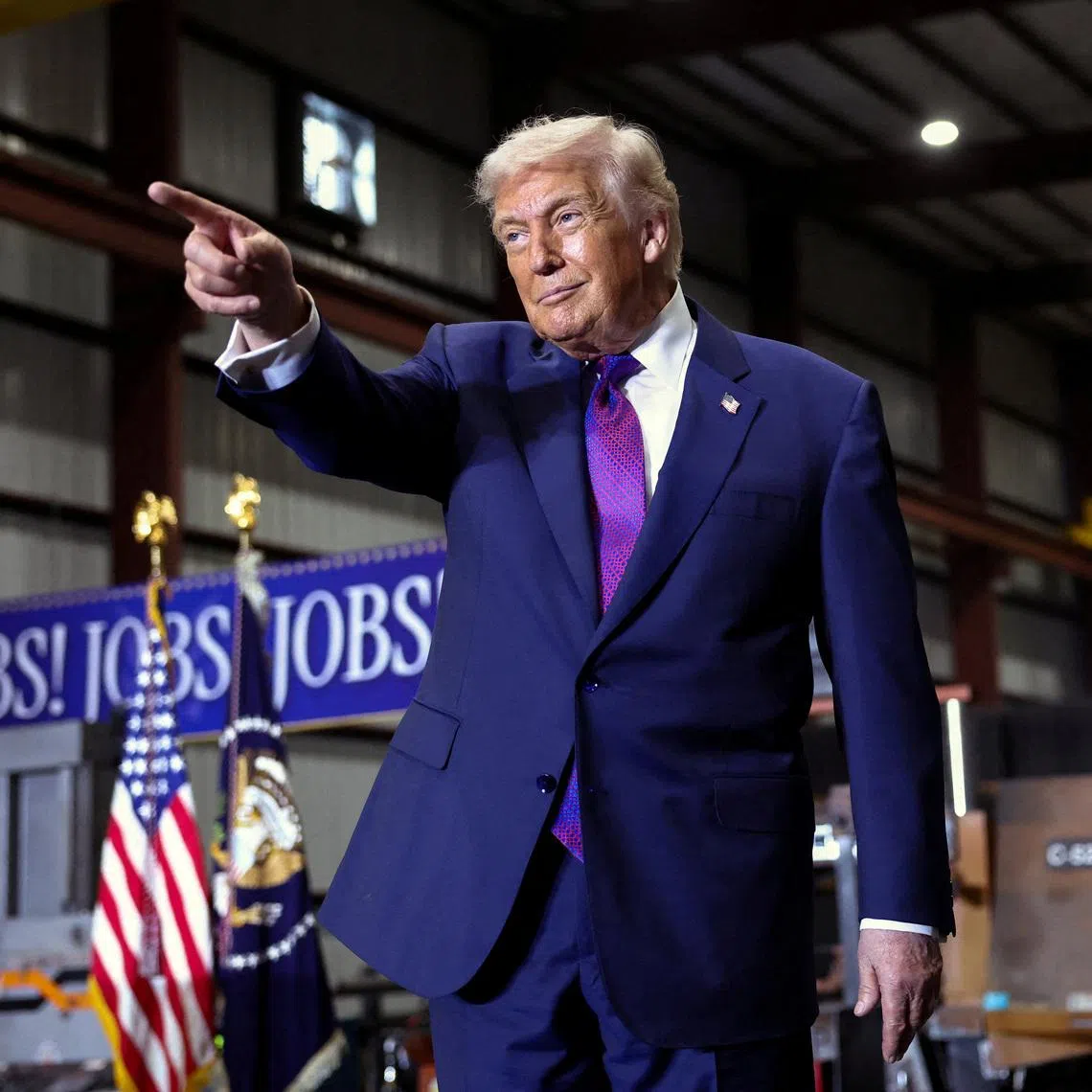 FILE PHOTO: U.S. President Donald Trump points, as he visits Coosa Steel Corporation, in Rome, Georgia, U.S., February 19, 2026. REUTERS/Kevin Lamarque/File Photo